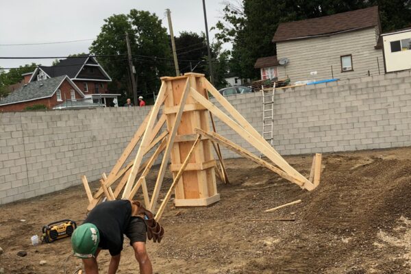 construction worker working on adding in building framing - J.R. Construction LTD - midland on