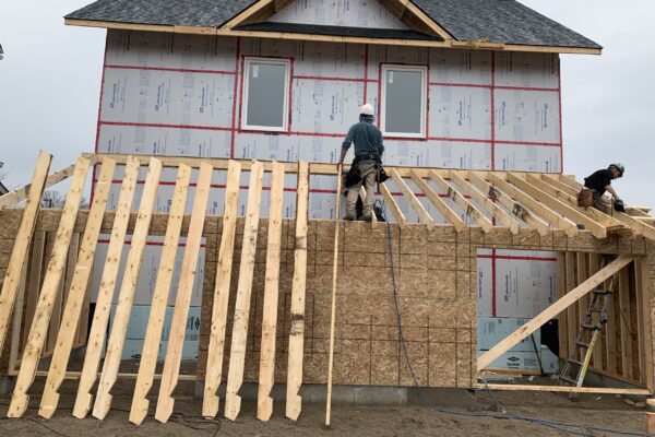 workers adding in framing for a building foundation d framing being added for a commercial building - J.R. Construction LTD - midland on