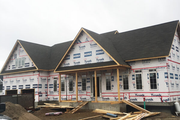 foundation and framing for a large two story residential home with deck and garage - J.R. Construction LTD - midland on