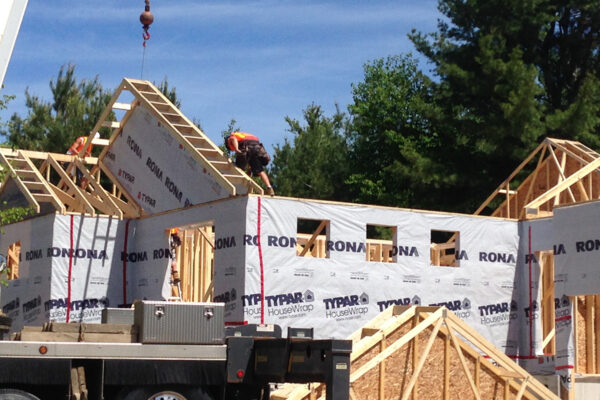 workers adding in roof framing for a residential home - J.R. Construction LTD - midland on